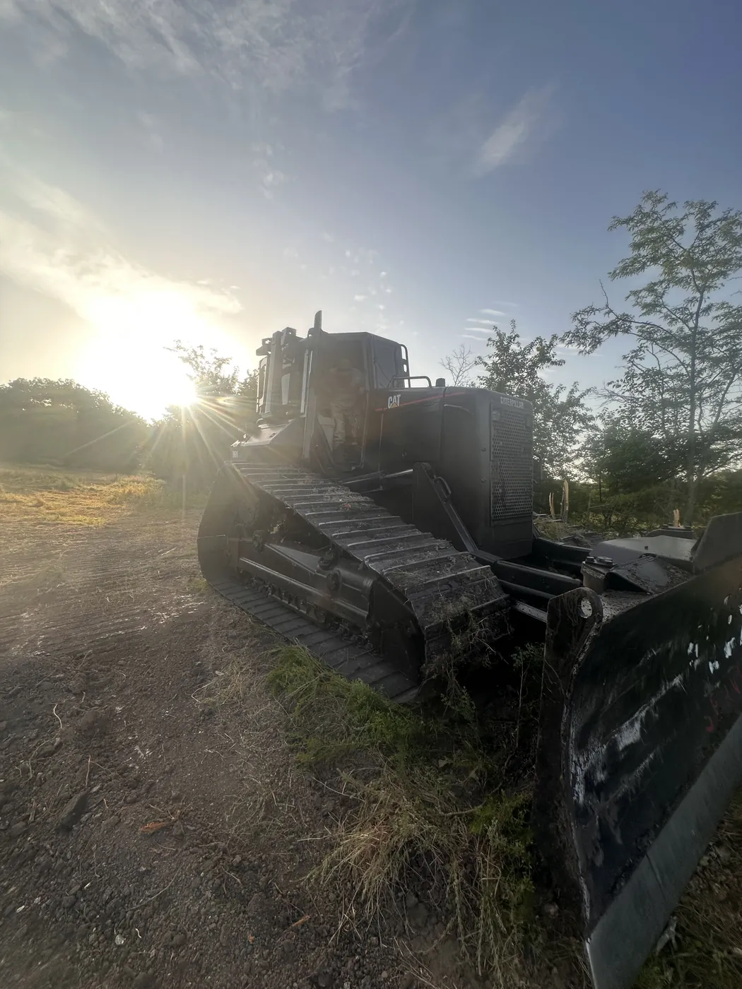 Rezz Built dozer staged on a cleared Oklahoma property at first light